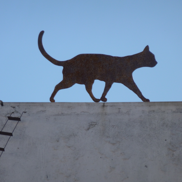 Artwork of a cat on a roof